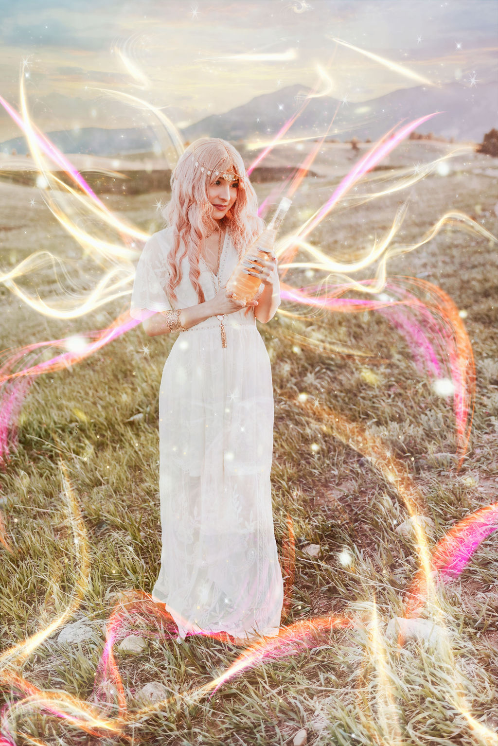Girl in a white dress with pink hair looks at a bottle of golden liquid as magic swirls around her for a fantasy photo shoot in Boulder Colorado by Kendra Colleen Photography